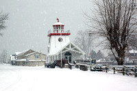 Snowy street, lighthouse.